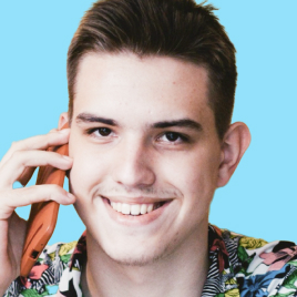 I'm Nikita Khristenko (https://nikitakhristenko.com) and I'm pictured here with medium hair with wear glasses which have two colours brown and black. I'm wearing a hoodie. I smile with my mouth open and shout something at the same time, while squinting into the distance. I'm wearing a shirt, a fleece, a T-shirt, and a long-sleeve hooded sweatshirt. The photo is in black, the background is replaced with yellow, this is the style of UNICORN WITNESSES brand (unicornwitnesses.com)